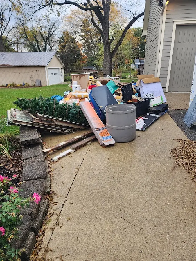 Dumpster being loaded with debris for Estate Cleanout Dumpster Rental in Elk Grove Village